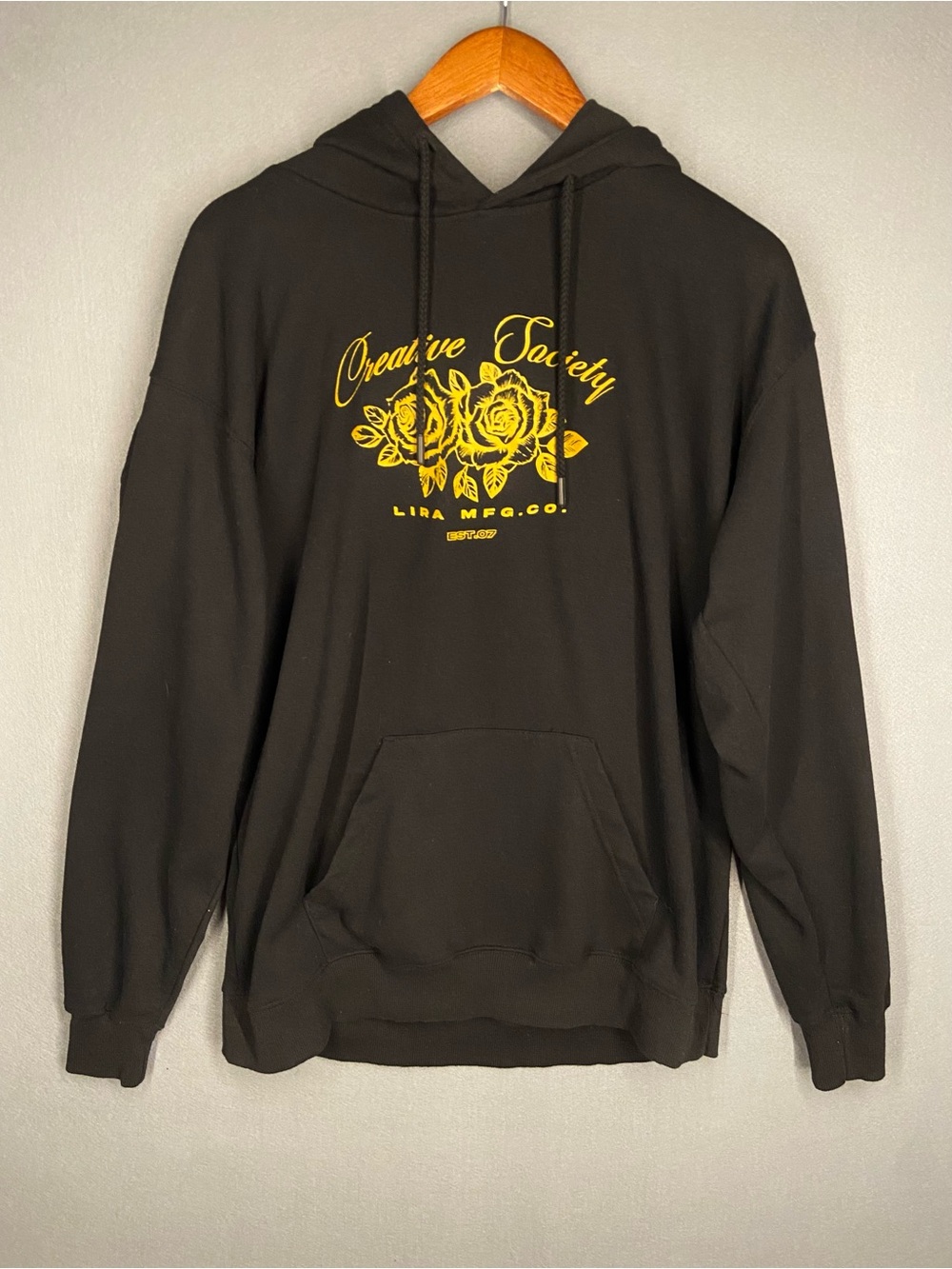 Lira Creative Society Black Hoodie with Yellow Rose Graphic